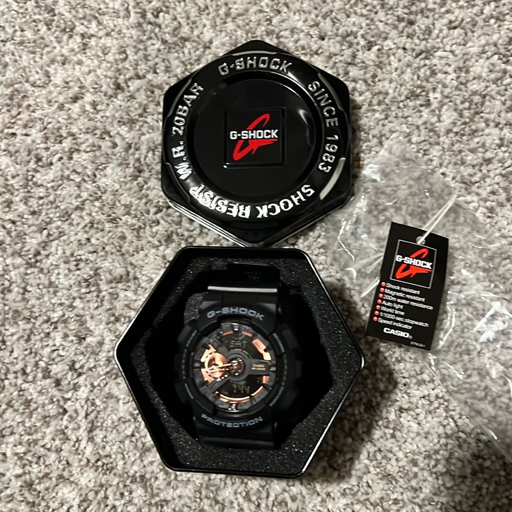 G-shock by Casio black with gold accents watch